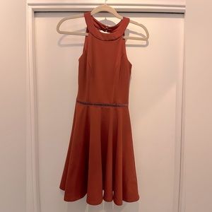 Halter style dress with lace detail around waist & on the back